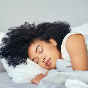 A woman sleeping peacefully so that she gets enough rest