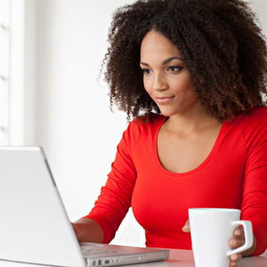 A smiling woman  workings from home.